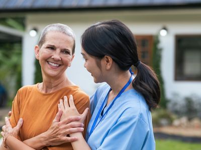 nurse in patients garden at home