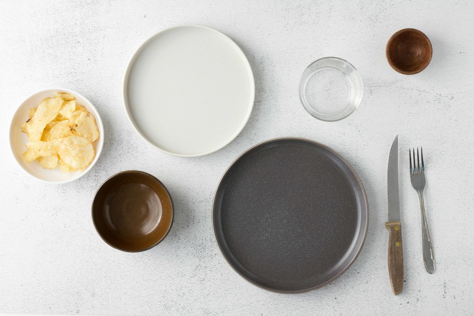 Empty plates and bowls ready for a meal