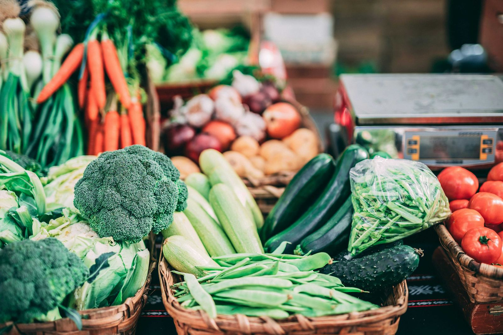 Baskets of fresh vegetables – broccoli, zucchini and green beans
