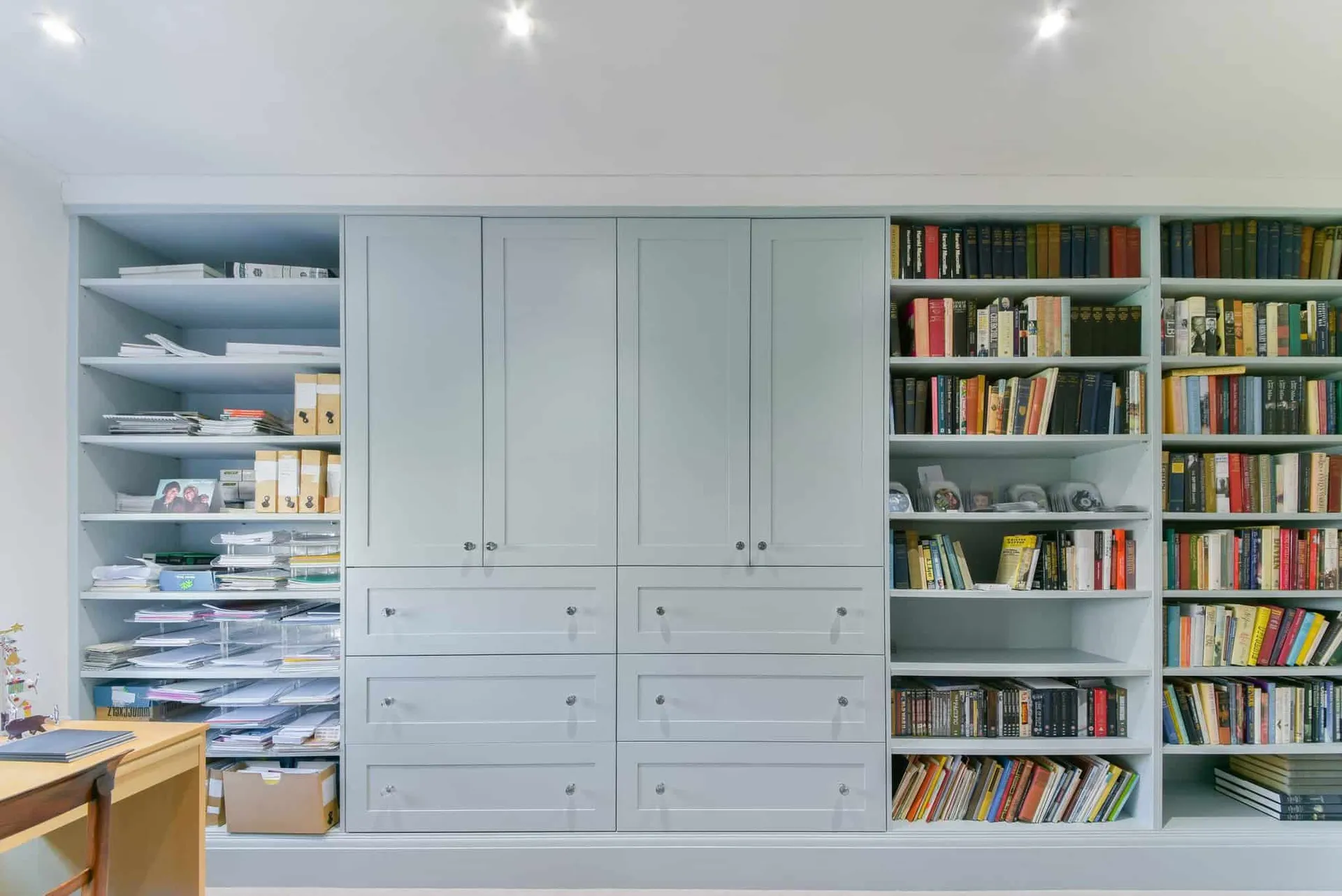 Bespoke fitted library and storage in painted joinery