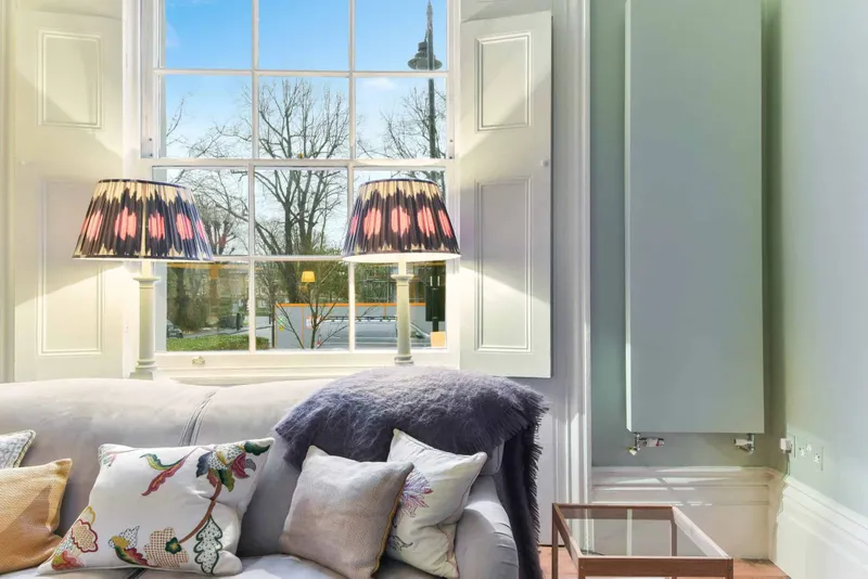 Drawing room sash window with restored panelled shutters