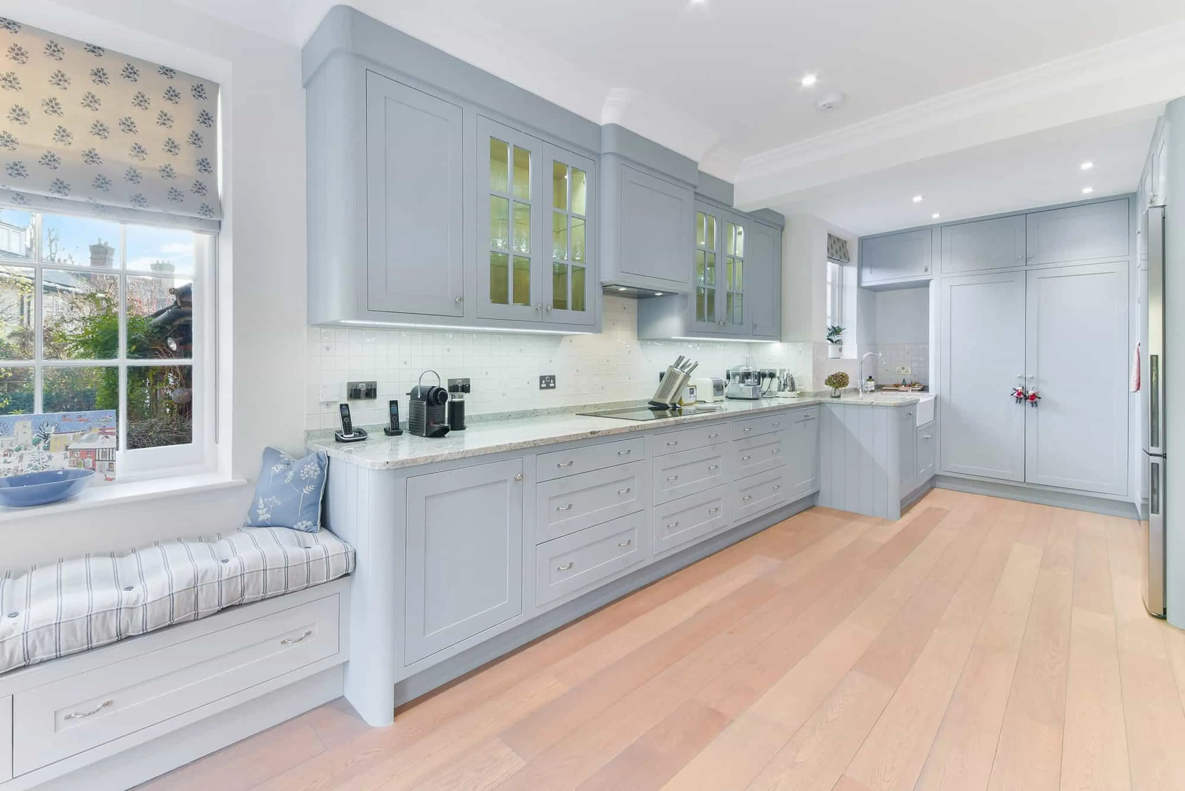 Kitchen looking through to the bay window seat with fitted storage below