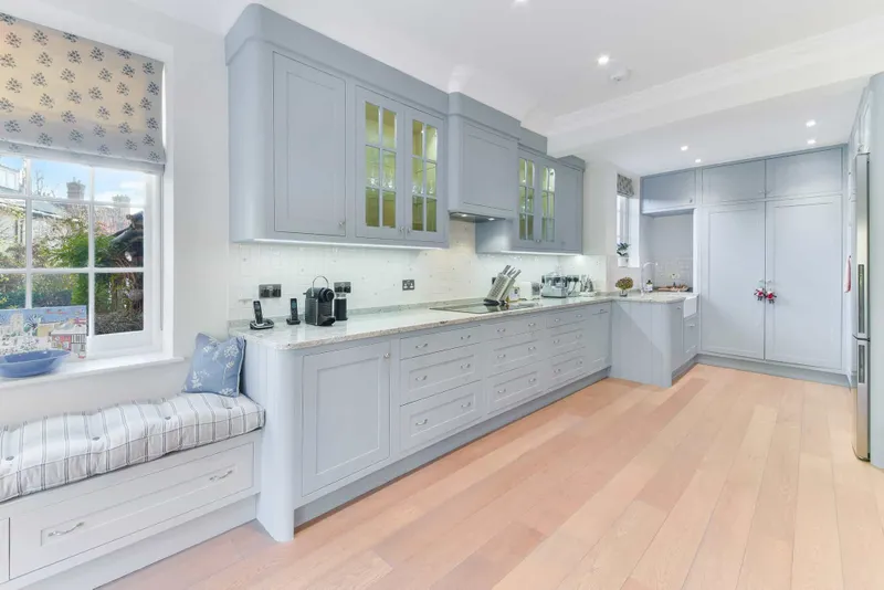 Kitchen looking through to the bay window seat with fitted storage below