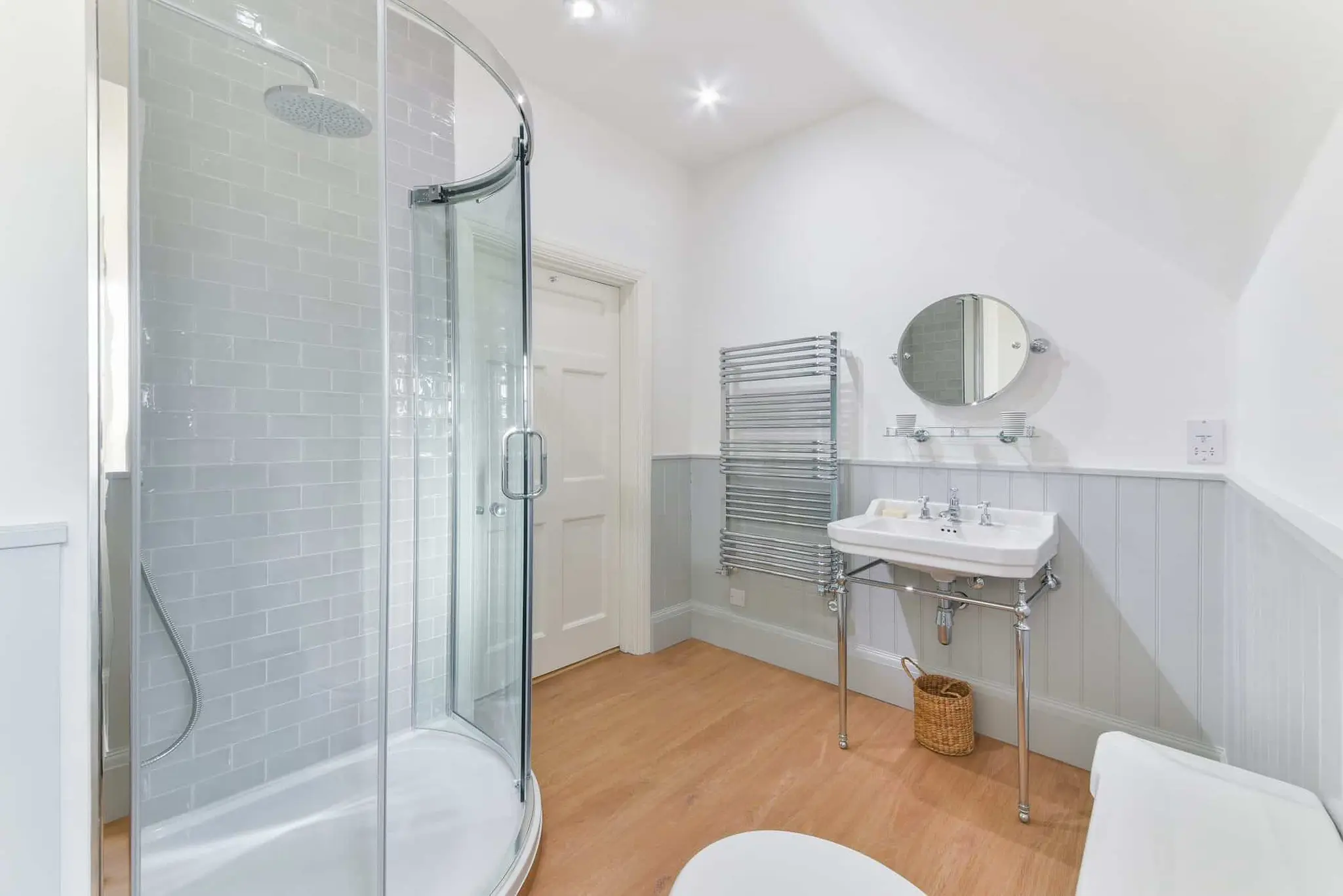 Shower room with corner enclosure and panelled dado