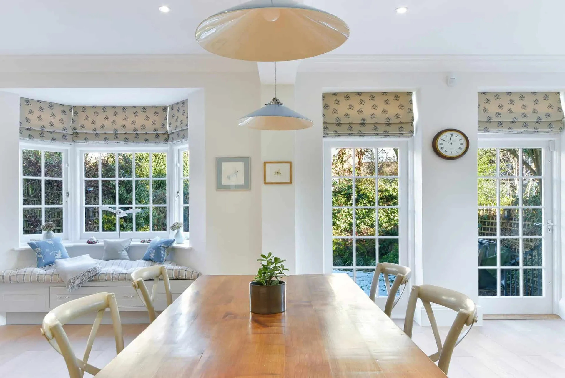 Dining area with pendant lighting and garden doors