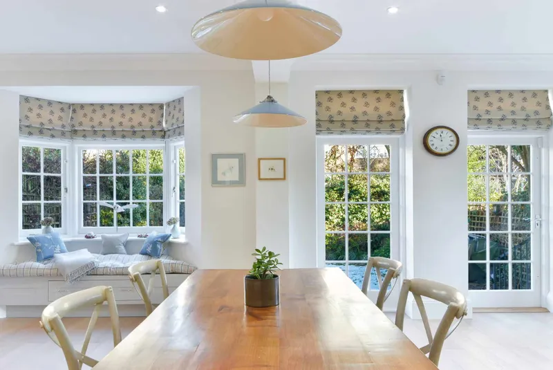 Dining area with pendant lighting and garden doors