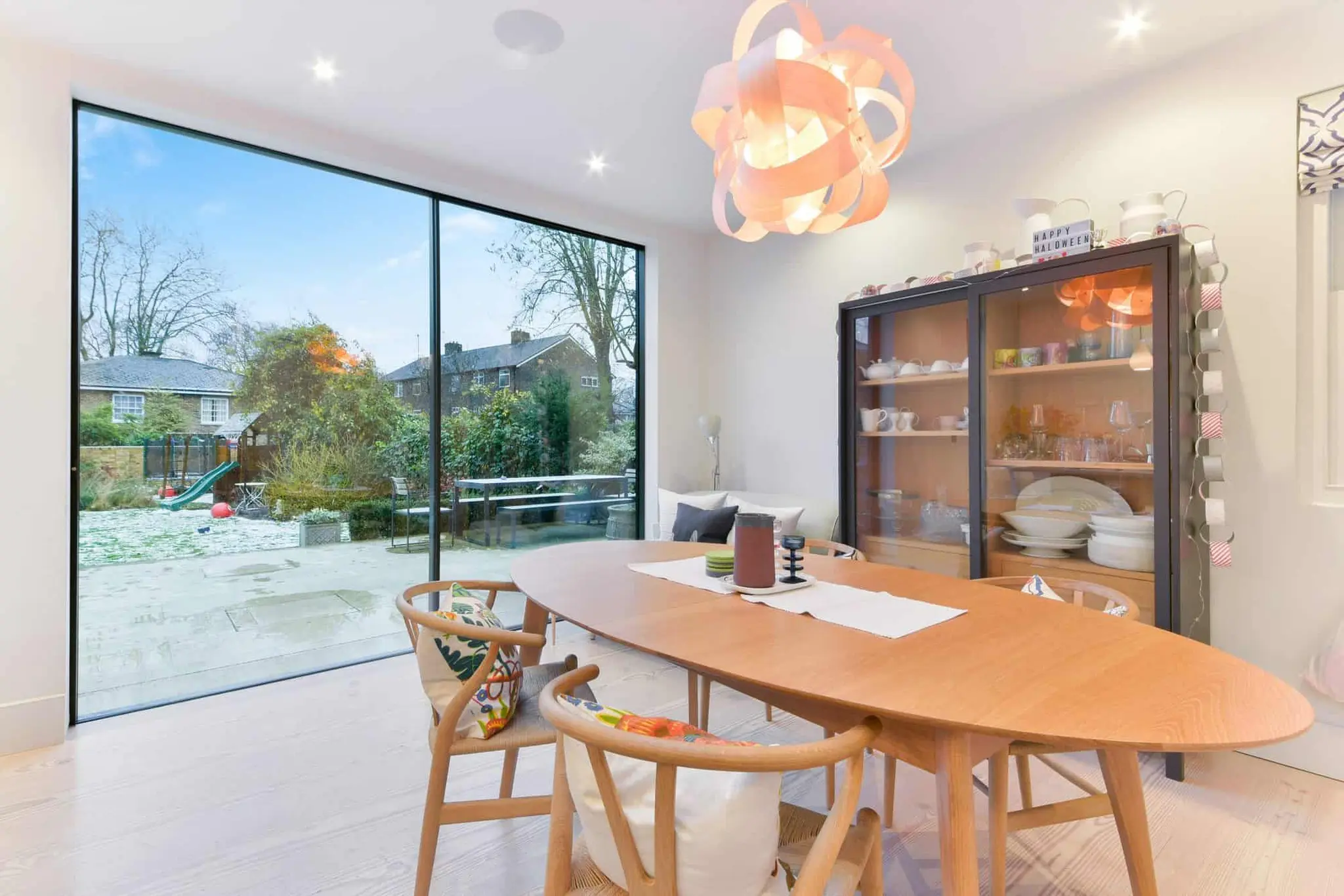 Dining end of the extension with full-height glazing to the garden