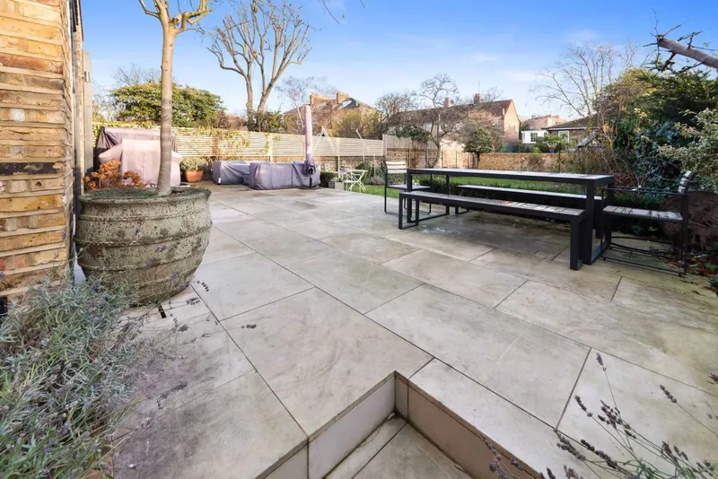 Stone paved terrace looking back across the garden