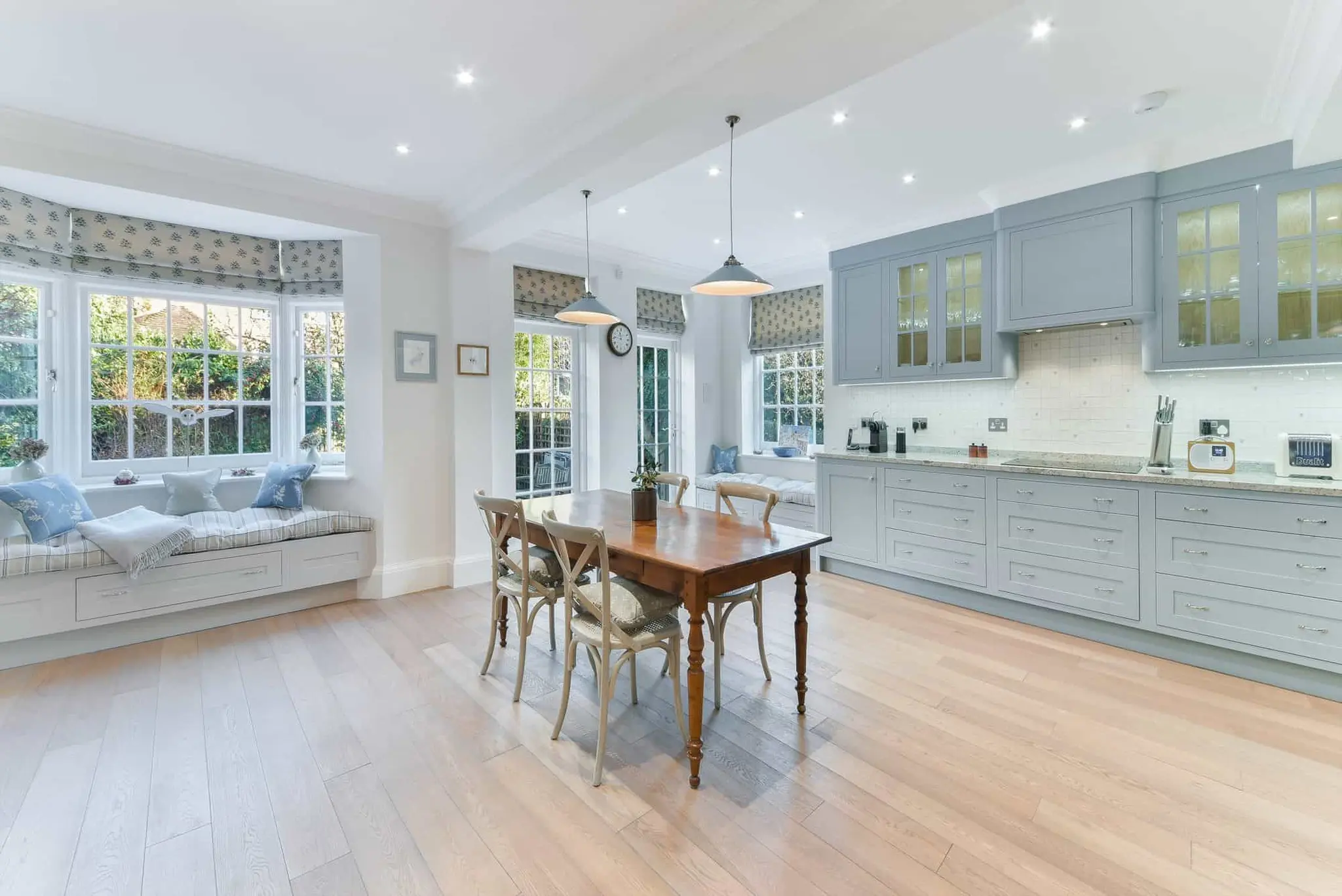 Open-plan kitchen and dining room with bay window seating