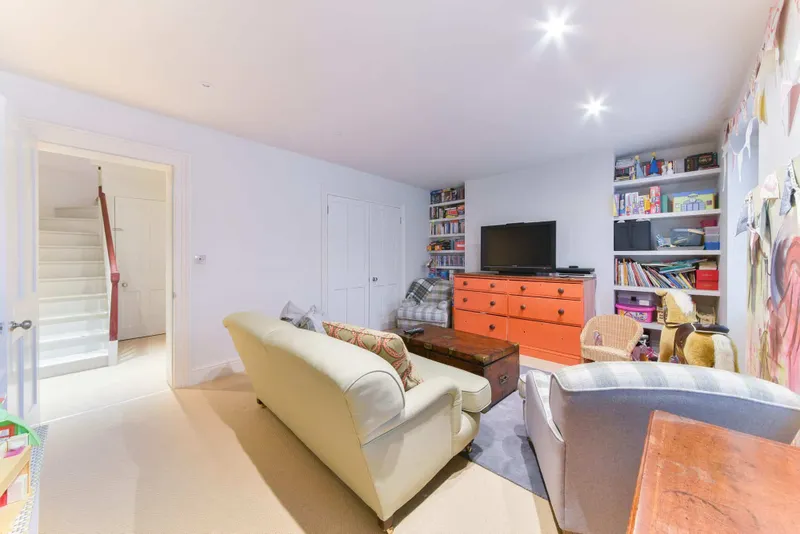 Lower-ground family room with fitted shelving