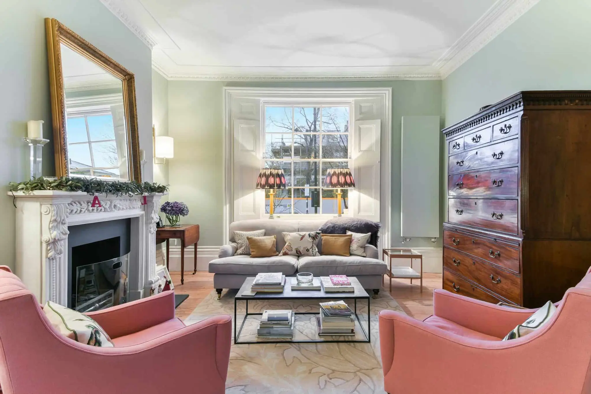 Front drawing room with marble fireplace, gilt mirror and restored cornice