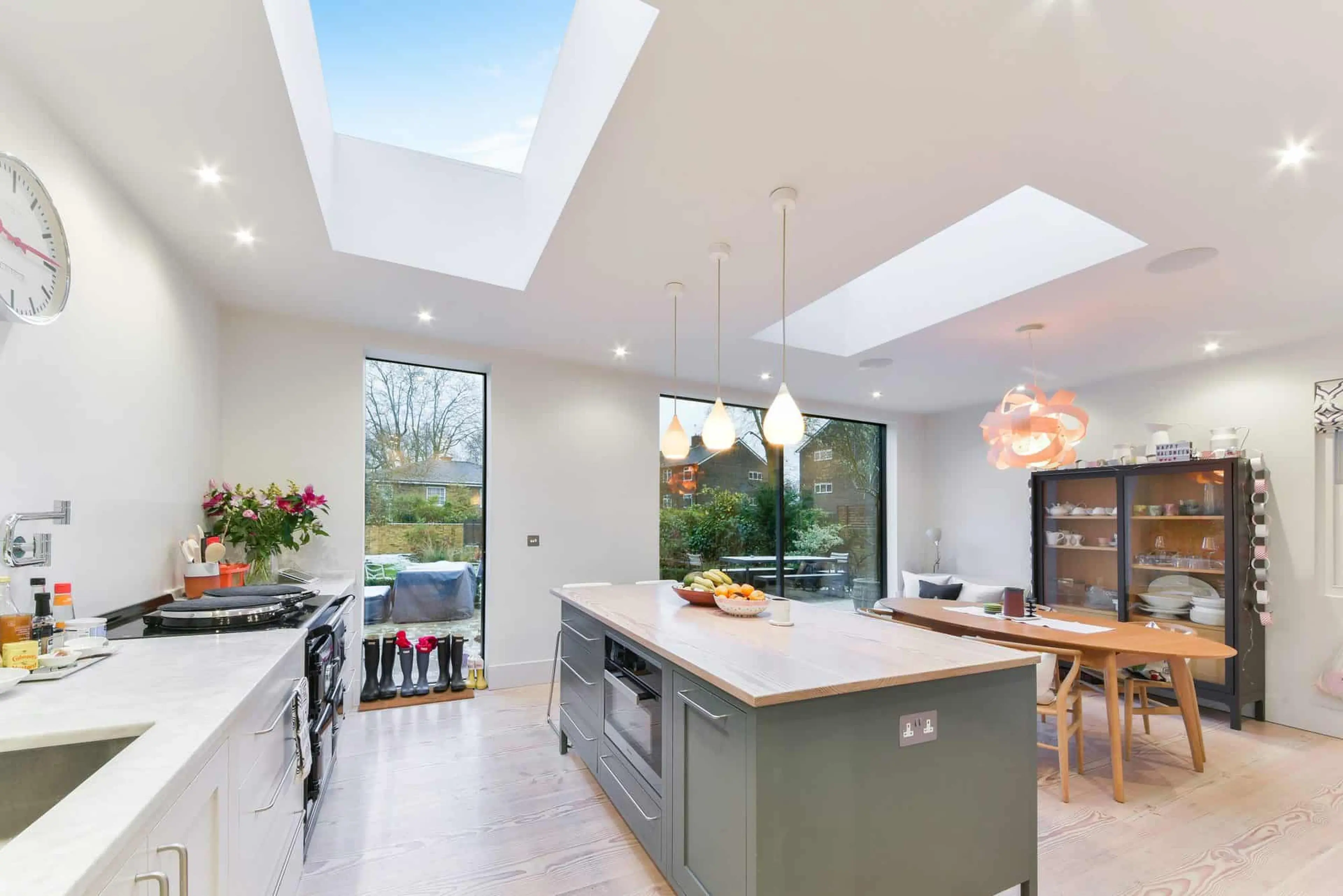 Kitchen with an AGA, marble worktop, solid timber island and both glass roof lights