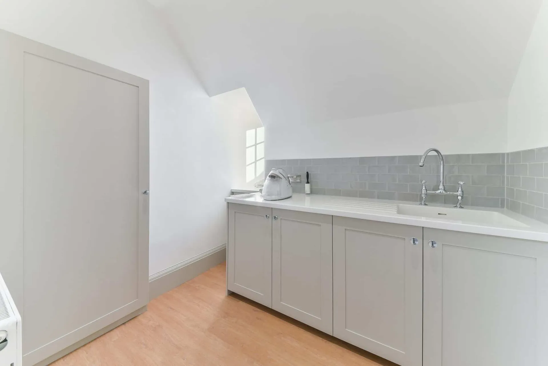 Attic room with fitted units and sink