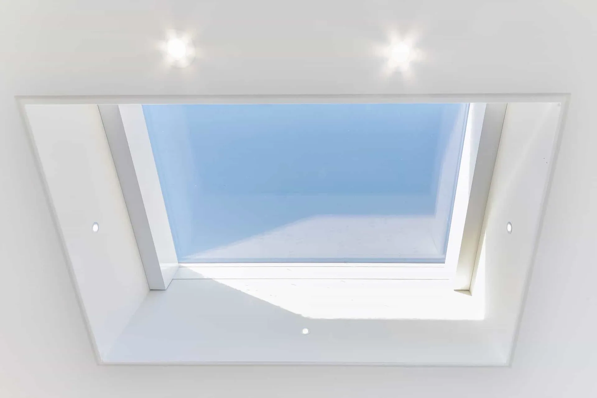 Custom-made electric roof light set into the ceiling