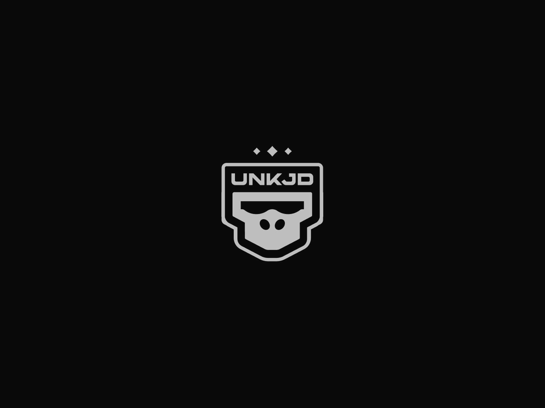 Graphic design logo variation asset showing a stylized vector badge that integrates a primate icon and futuristic block typography on a solid dark canvas.