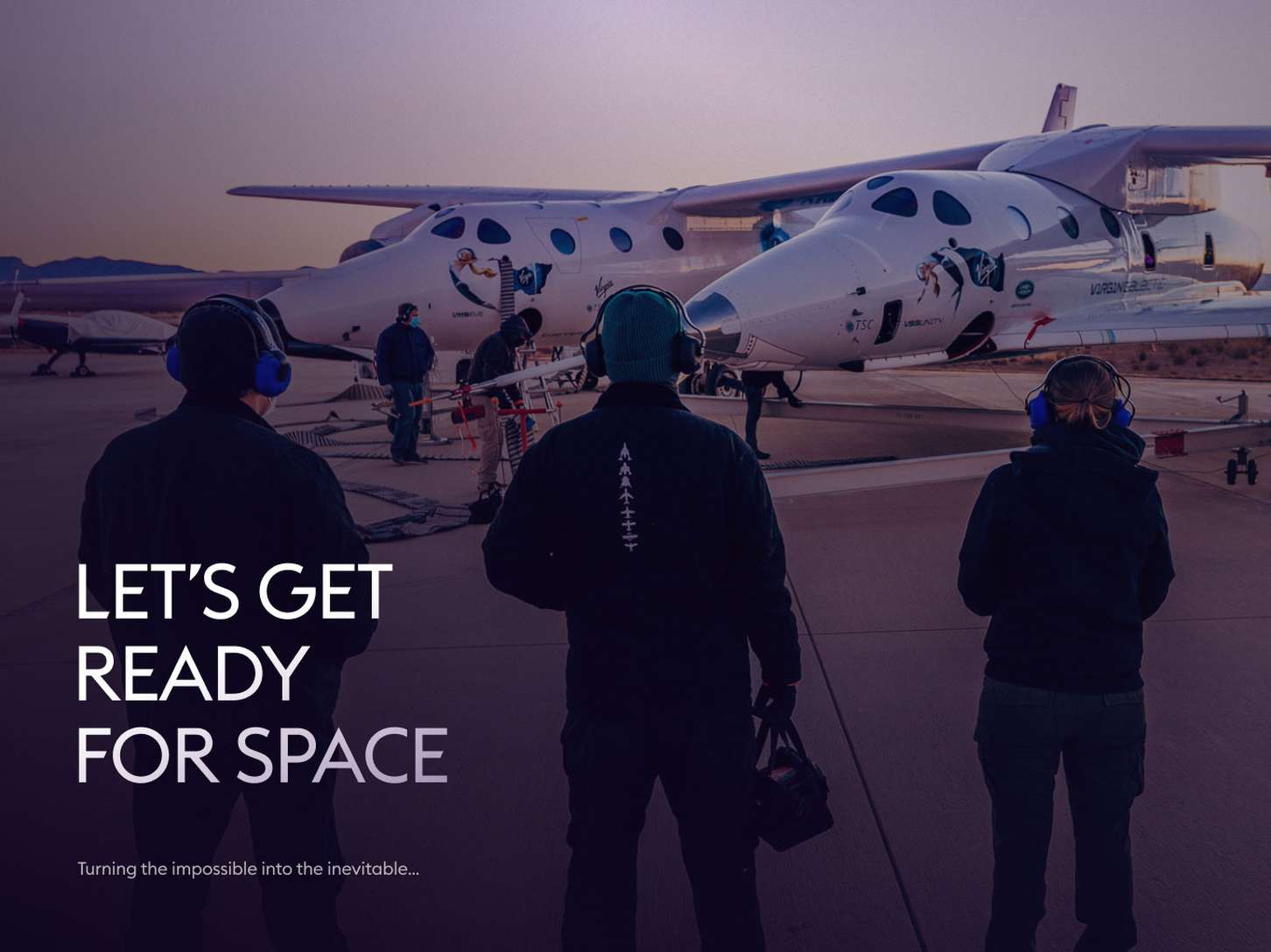 Three people in headsets stand near a white spaceplane on a tarmac at dawn, with the text "Let's Get Ready for Space."