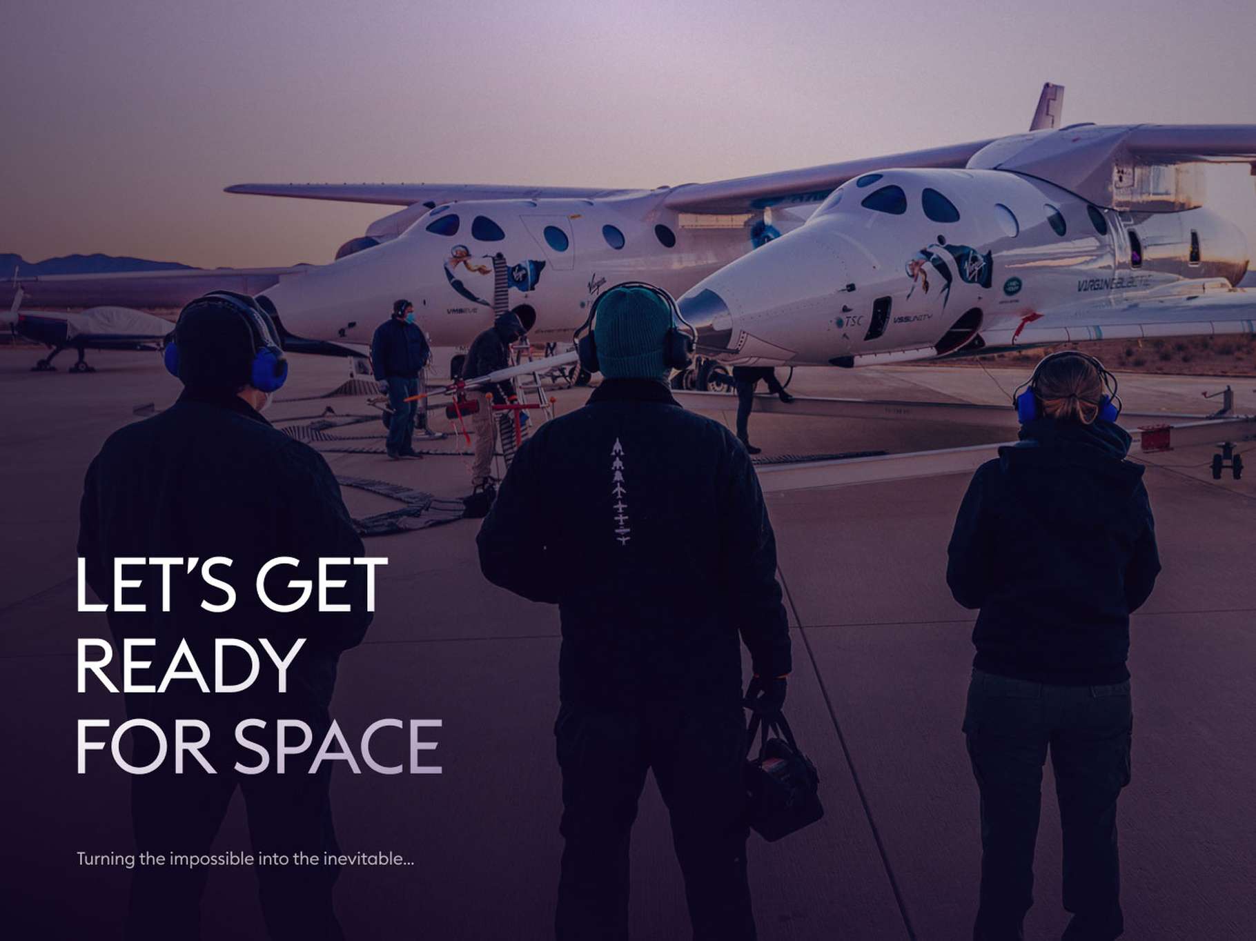 Three people in headsets stand near a white spaceplane on a tarmac at dawn, with the text "Let's Get Ready for Space."