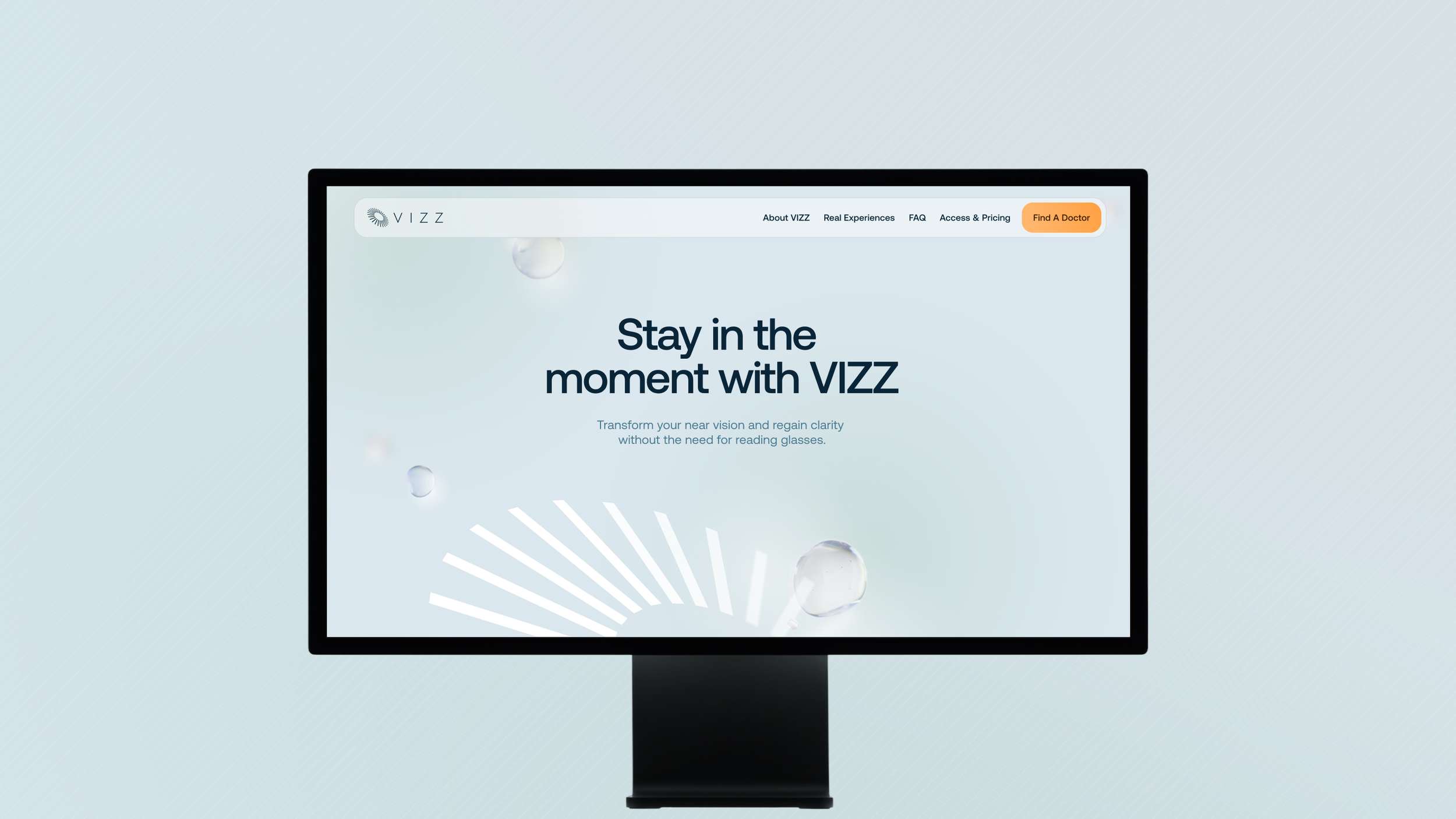 Desktop website display mockup for VIZZ ophthalmic brand. The screen shows a prominent headline focused on near vision transformation, a white sunburst vector graphic on the bottom left, and a sleek header navigation menu.