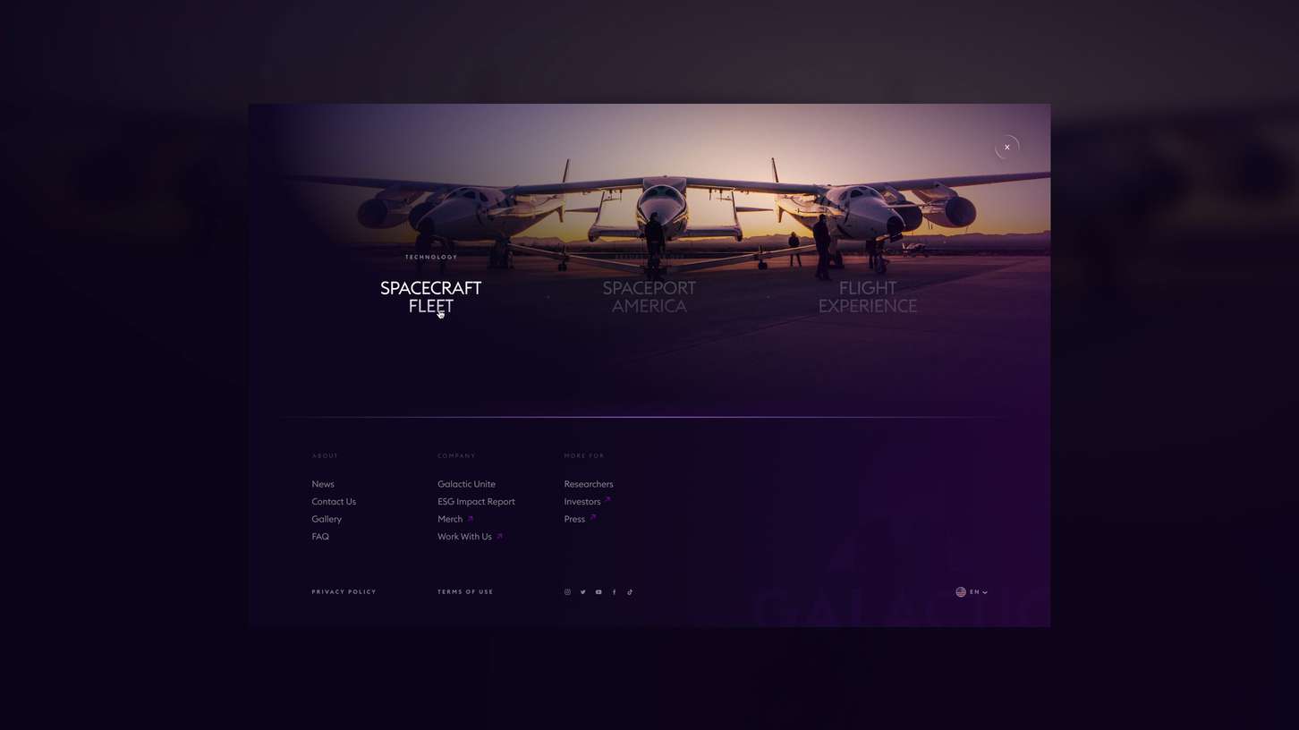Dark purple screen with text: "Spacecraft Fleet," "Spaceport America," "Flight Experience," and the Virgin Galactic logo in the top left.