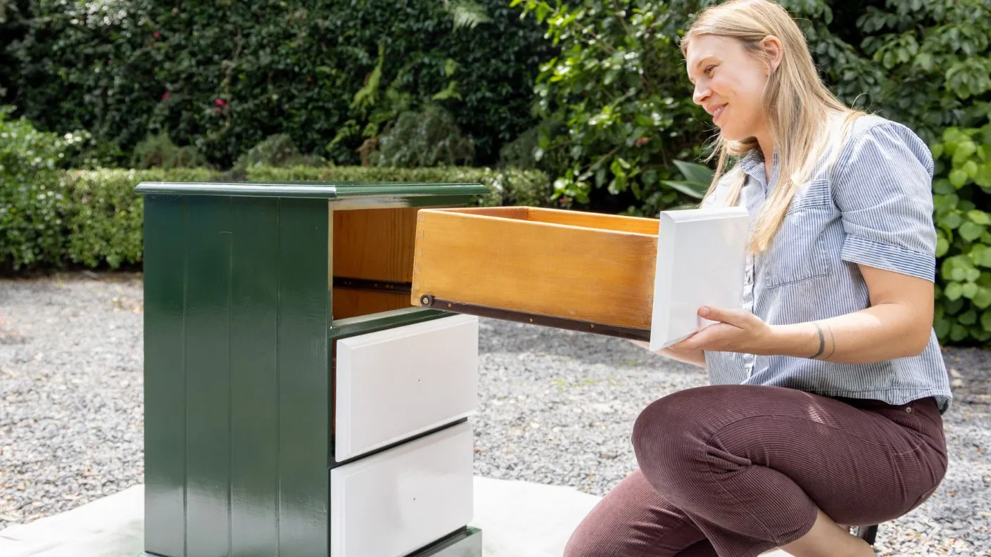 Woman including drawer into painted chest of drawers with White Knight Squirts
