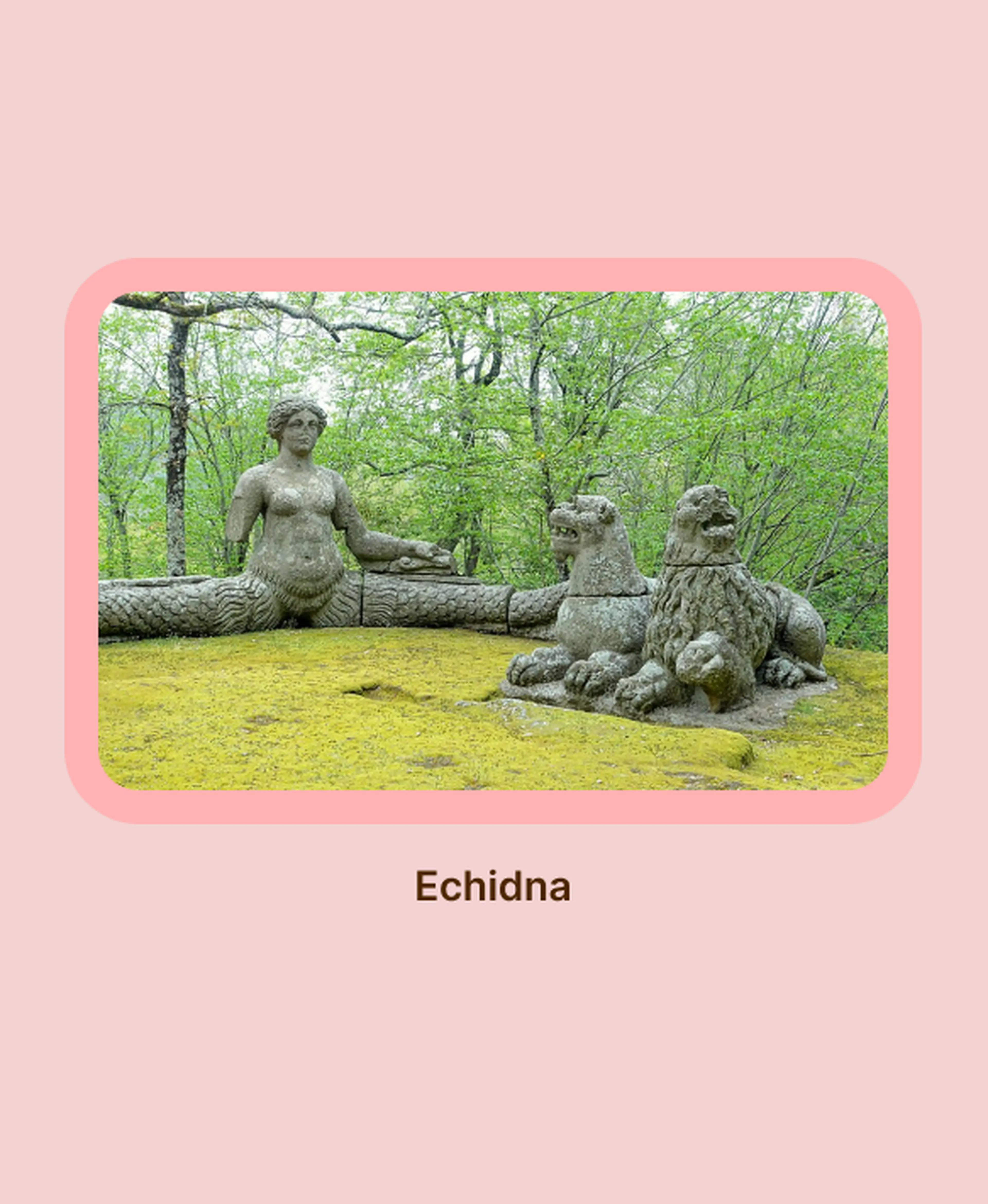 Weathered stone statue of Echidna, a half-woman half-serpent figure from Greek mythology, beside creature sculptures on moss-covered ground amid lush green forest trees