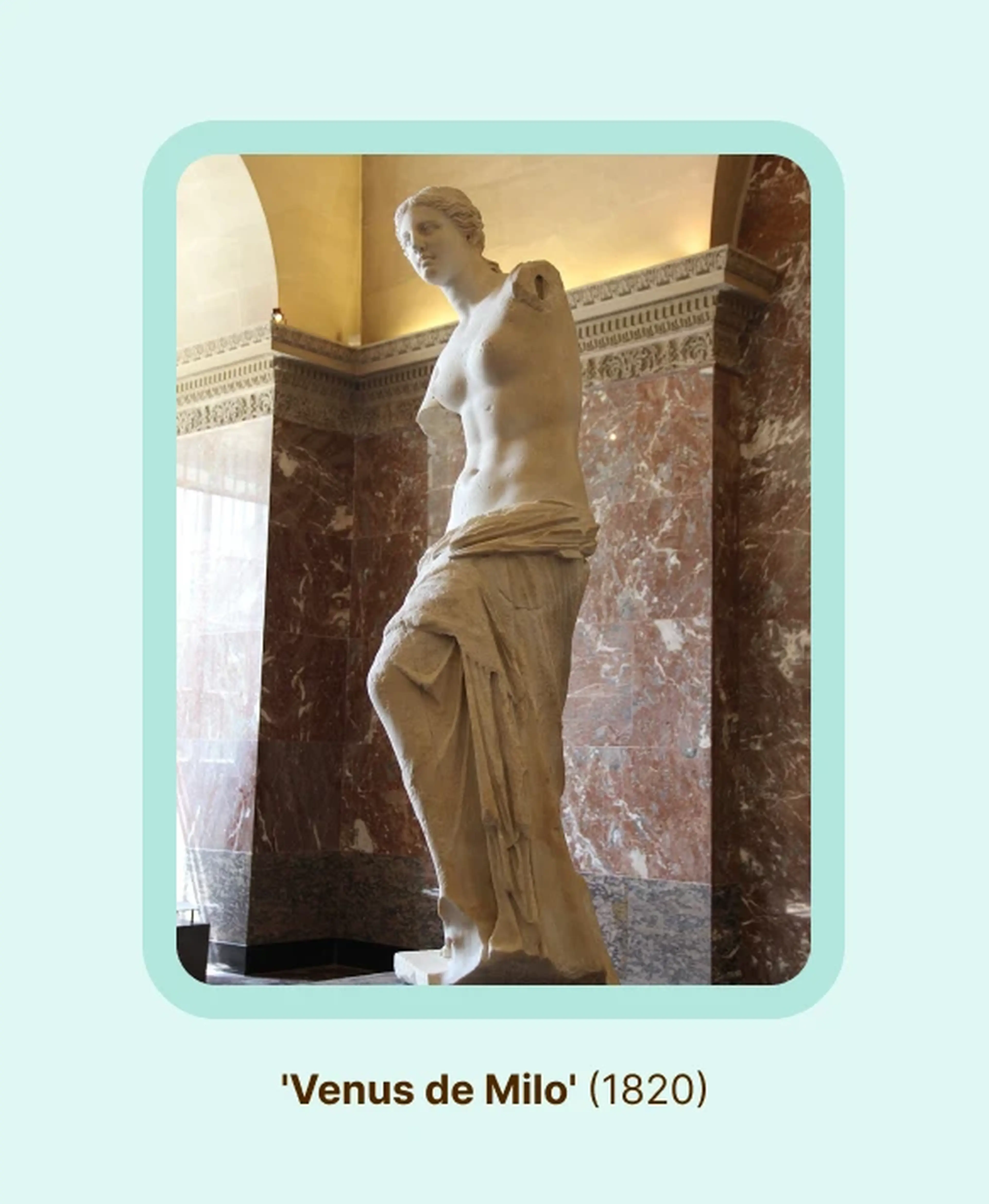 Venus de Milo marble statue, one of the world's famous sculptures, showing an armless female figure draped in flowing fabric displayed against marble columns in a museum hall