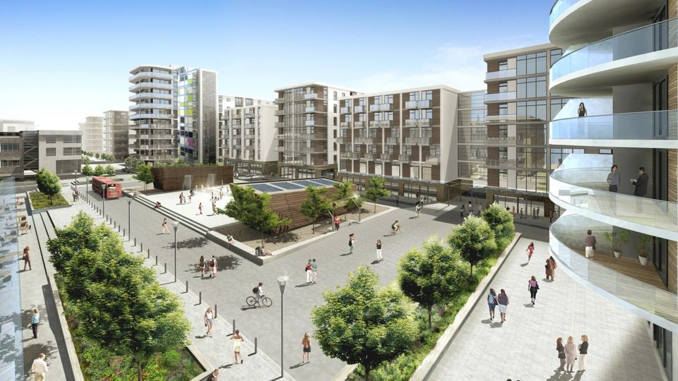 Modern urban development with multi-story buildings, balconies, greenery, and people walking and cycling in a spacious courtyard under a clear blue sky.