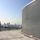 Rooftop view of the London skyline with St Paul's Cathedral and the London Eye. On the roof is a screening louvre.