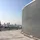 Rooftop view of the London skyline with St Paul's Cathedral and the London Eye. On the roof is a screening louvre.