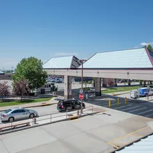 Liteway™ FRP ridge canopy system over walkway between parking and airport entryway