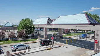 Liteway™ FRP ridge canopy system over walkway between parking and airport entryway