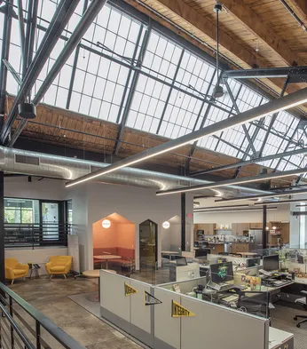 GridSpan FRP panel skylight in adaptive reuse space converted from warehouse to office