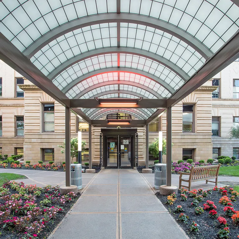 Liteway™ FRP curved canopy system over walkway between two hospital buildings