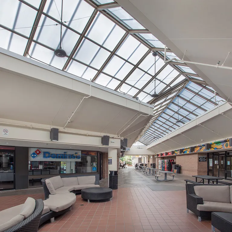 QuadSpan™ polycarbonate skylight over walkway area between two buildings.