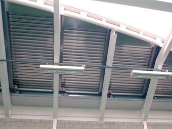 Interior view of a ceiling in football academy with Colt natural ventilation system.