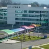 Brightly colored Briteway® polycarbonate canopy over walkway / sidewalk area.