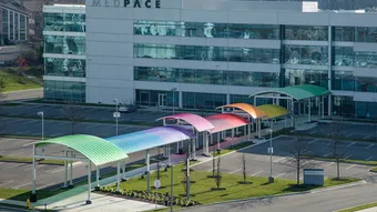 Brightly colored Briteway® polycarbonate canopy over walkway / sidewalk area.