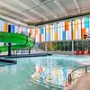 UnIQuad polycarbonate wall system with multiple glazing colors - in aquatic center pool area