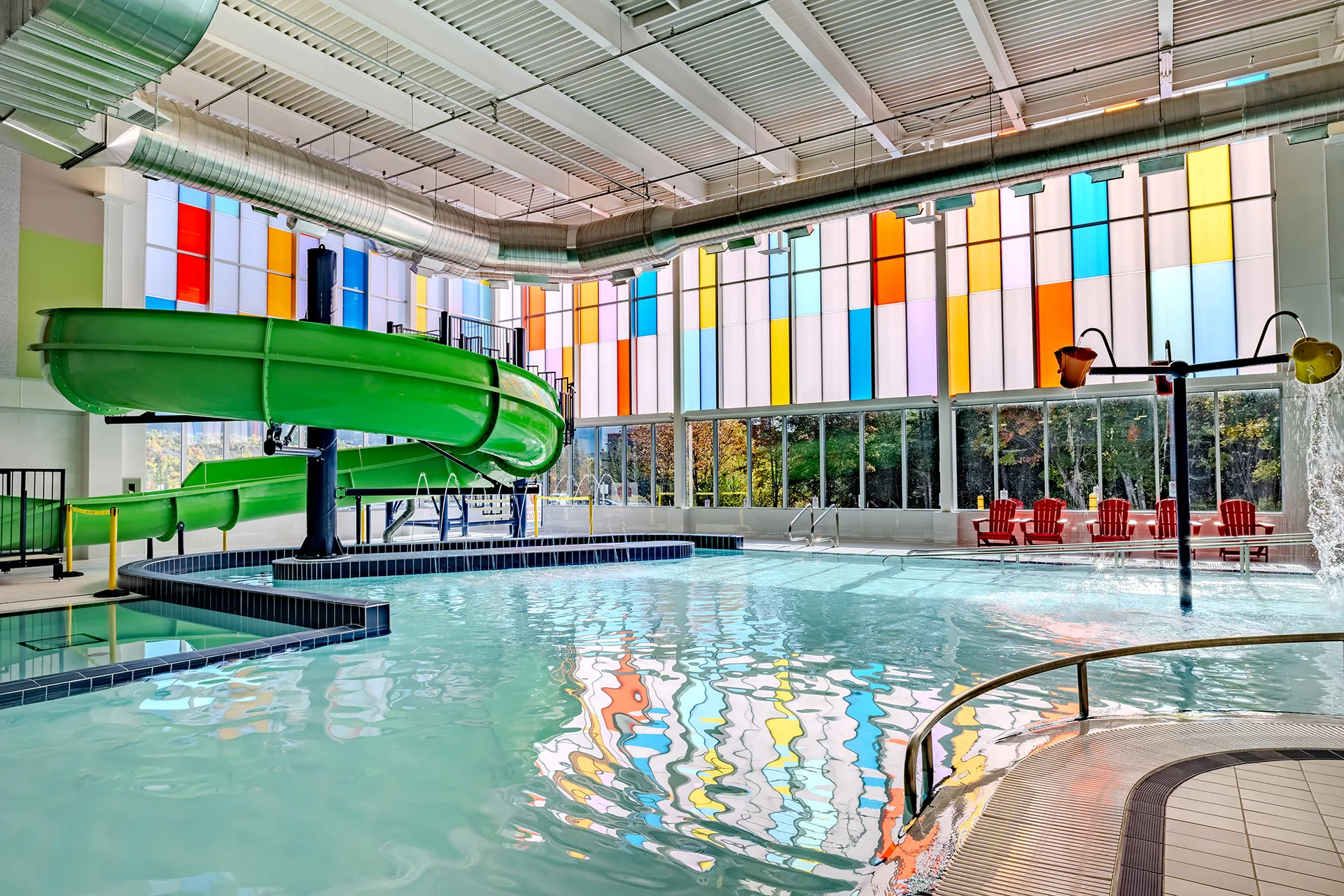 UnIQuad polycarbonate wall system with multiple glazing colors - in aquatic center pool area