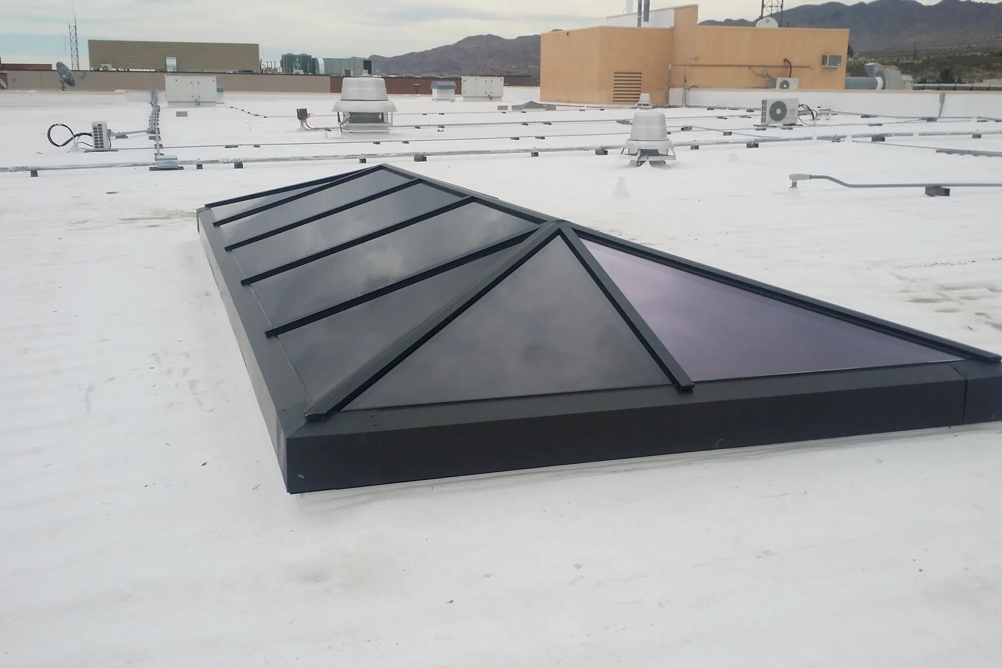 KlearSky™ custom hip ridge skylight on roof viewed from exterior