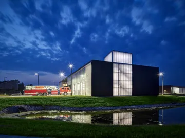 UniQuad polycarbonate wall system - exterior view of fire station with backlit panels