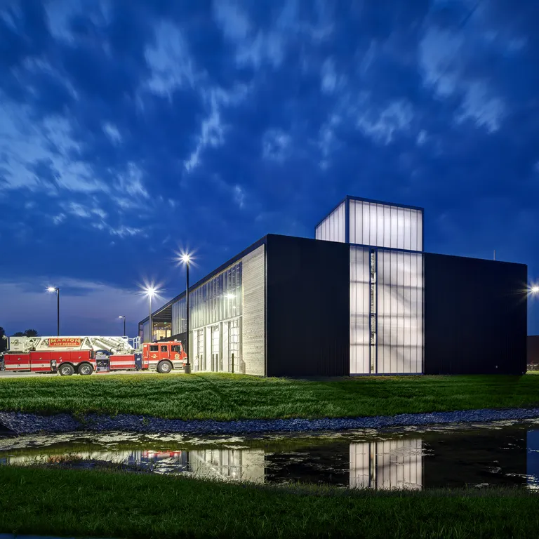 UniQuad polycarbonate wall system - exterior view of fire station with backlit panels