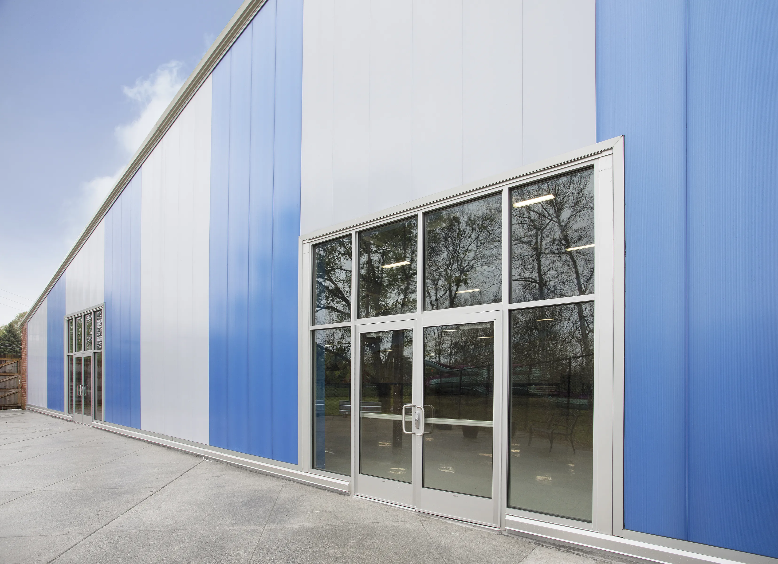 UniQuad wall system - exterior view with white and blue glazing colors