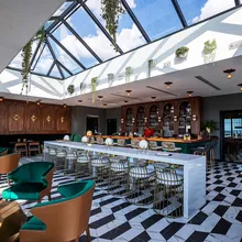 KlearSky™ custom glass hip ridge skylight in restaurant space