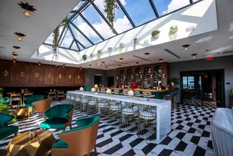 KlearSky™ custom glass hip ridge skylight in restaurant space