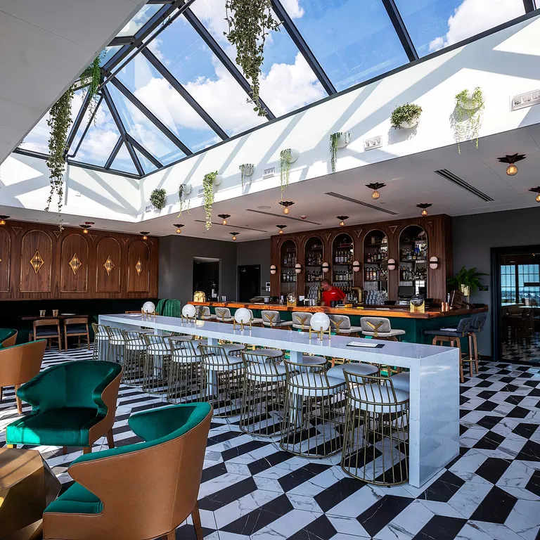 KlearSky™ custom glass hip ridge skylight in restaurant space