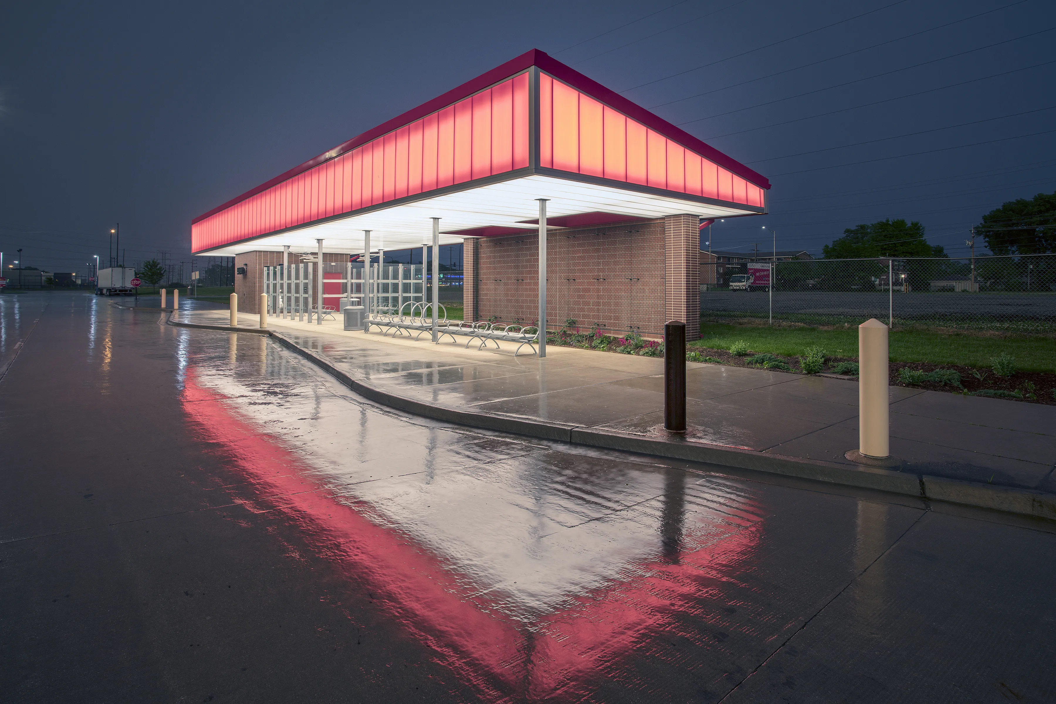 PentaClad™ polycarbonate cladding system in bright colors to match a sports team and highlight a pick-up area for transportation
