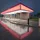 PentaClad™ polycarbonate cladding system in bright colors to match a sports team and highlight a pick-up area for transportation