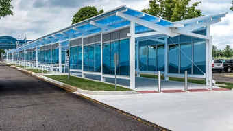 Briteway® polycarbonate canopy over airport walkway from terminal to parking