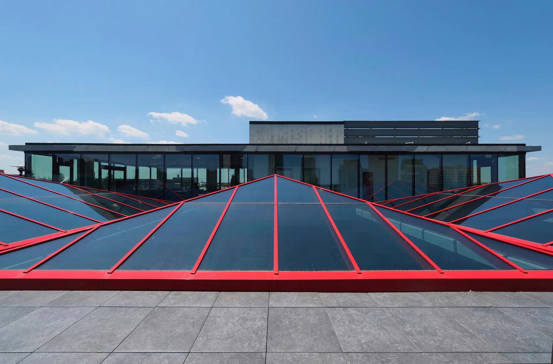 KlearSky™ custom glass pyramid skylight with red aluminum finished framing